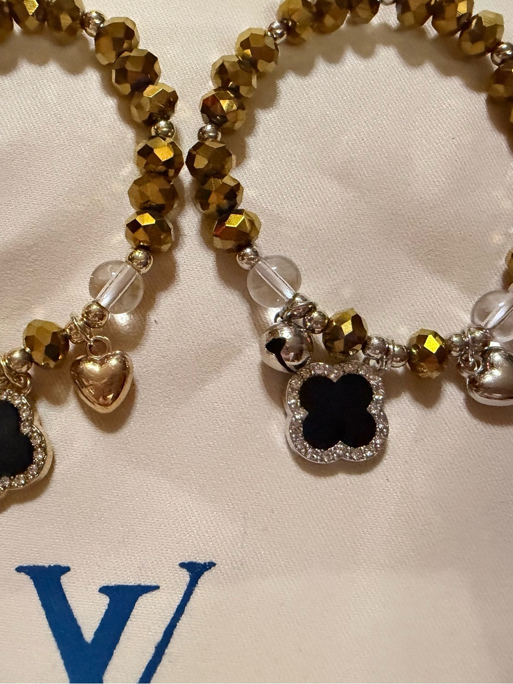 Gold Beaded Bracelet with Black Clover Charm